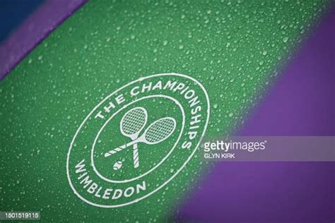 what happens when a tennis match is suspended due to rain|Rain suspends start of play at Wimbledon .